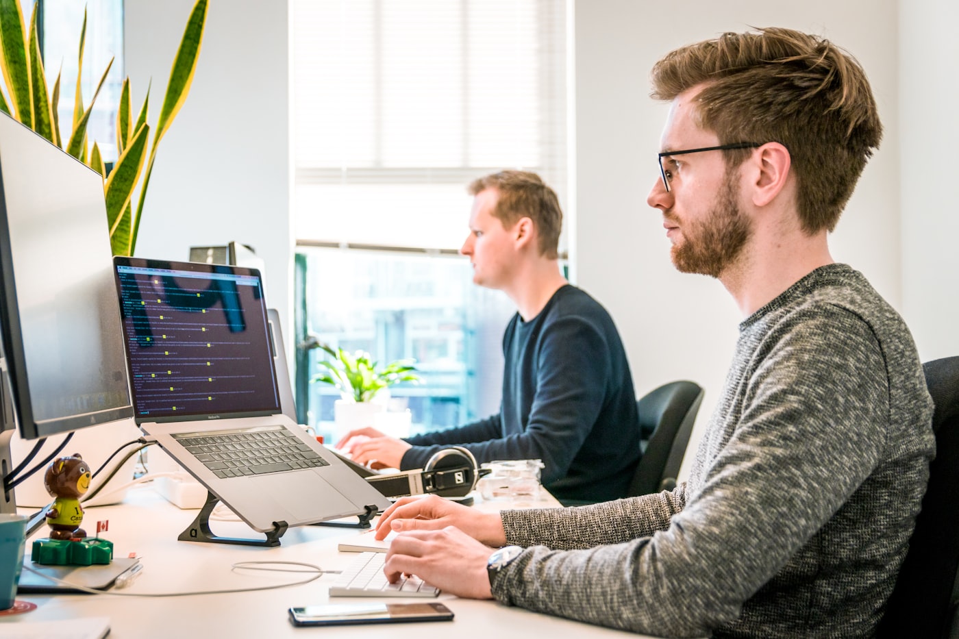 Engineers at work at a shared desk